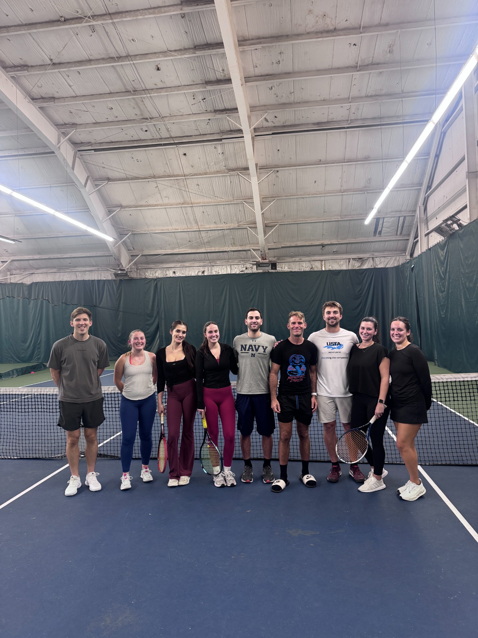 Players together on court after the October 15 Young Professionals Tennis Clinic at Twin Lakes